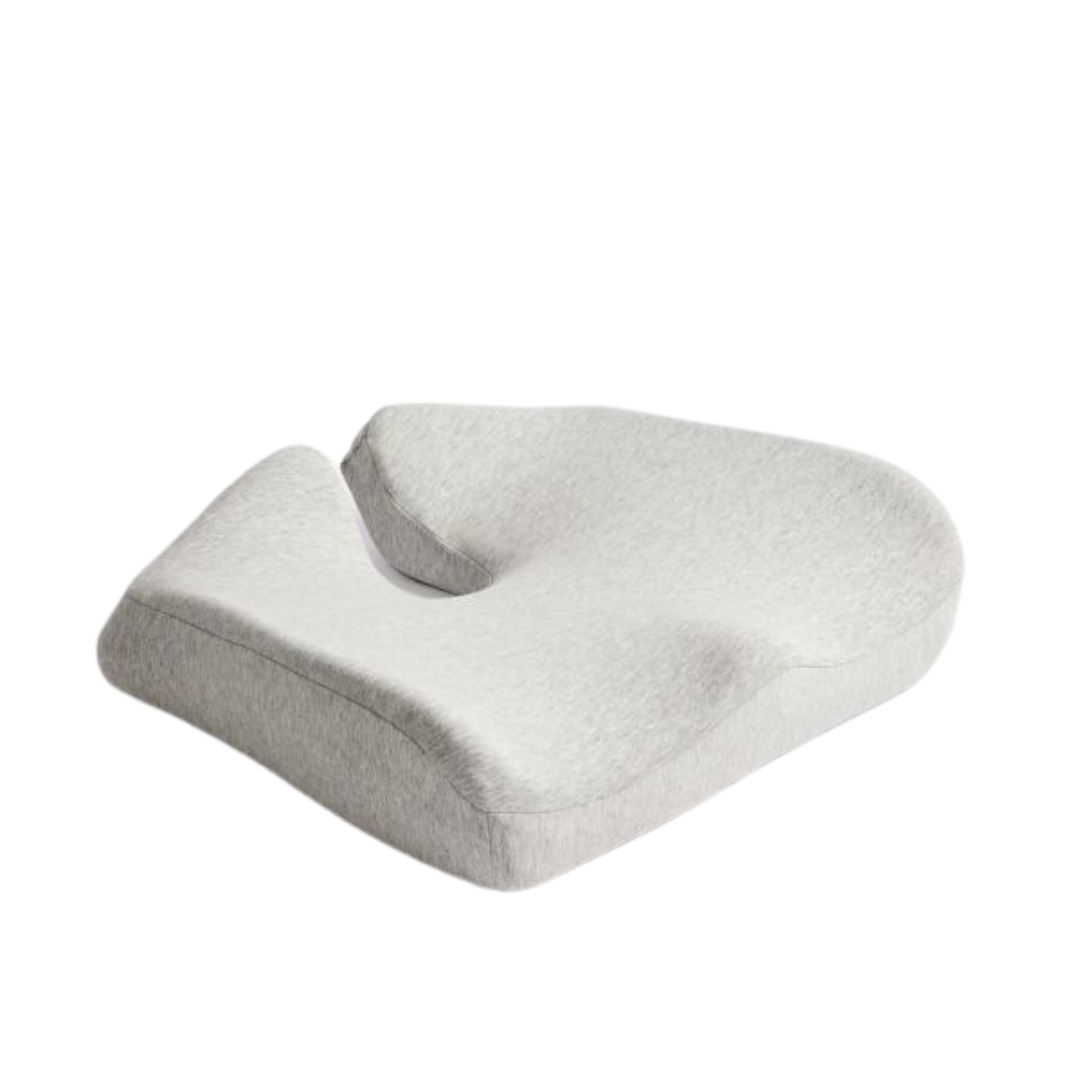 The iCare Reform Seat Support Cushion - Targeted Pressure Relief has an ergonomic, contoured gray design with a back cut-out and charcoal-infused ActiveX™ for enhanced comfort and support while sitting.